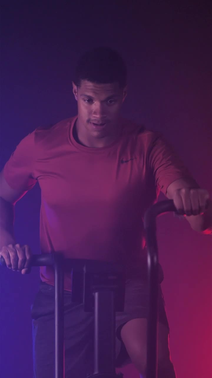 Free Video Stock Strong Man Exercising With A Fitness Air Bike Live Wallpaper - Free Download