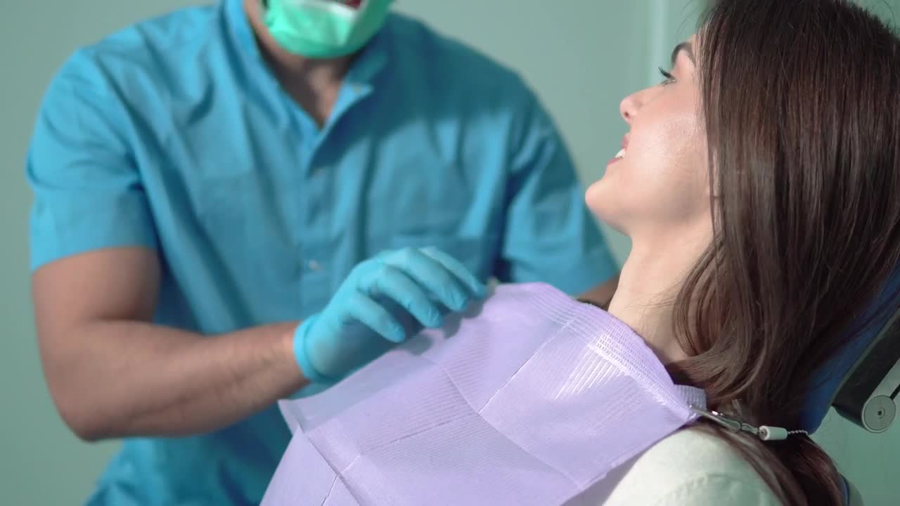 Stock Video Nurse In Face Mask Prepares Patient For Exam Live Wallpaper - Free Download