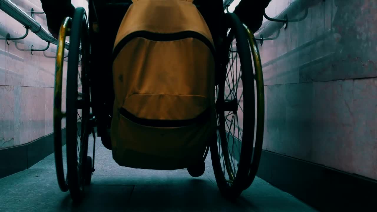 Stock Video Person In A Wheelchair Sliding Down A Narrow Slope Live Wallpaper - Free Download