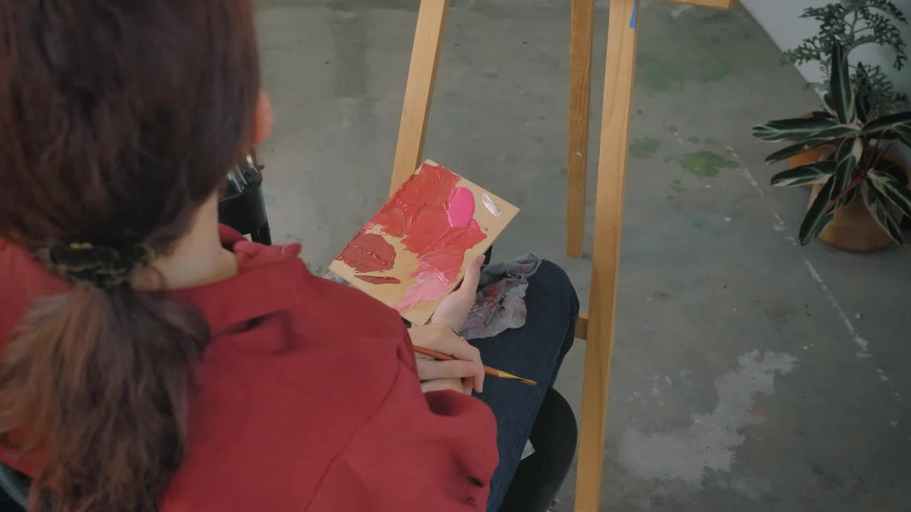 Stock Video Female Artist Painting A Picture In A Workshop Live Wallpaper For PC - Free Download