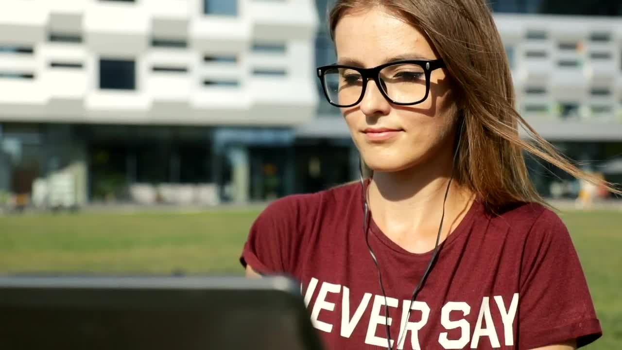 Free Video Stock Student Sitting Outside University With Laptop Live Wallpaper - Free Download