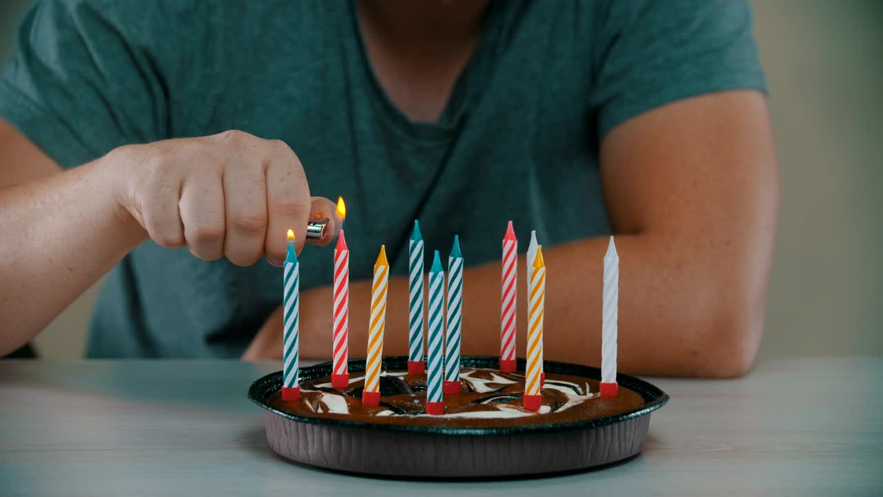 Stock Video Man Lighting Candles On A Small Birthday Cak Animated Wallpaper - Free Download