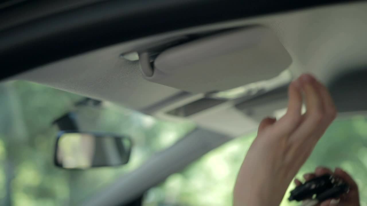 Stock Video Hiding Car Keys In The Sun Visor Animated Wallpaper - Free Download