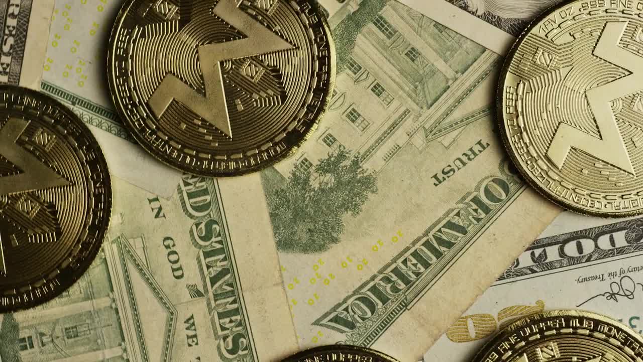 Stock Video Monero Cryptocurrency Coins Over Dollar Bill Animated Wallpaper - Free Download