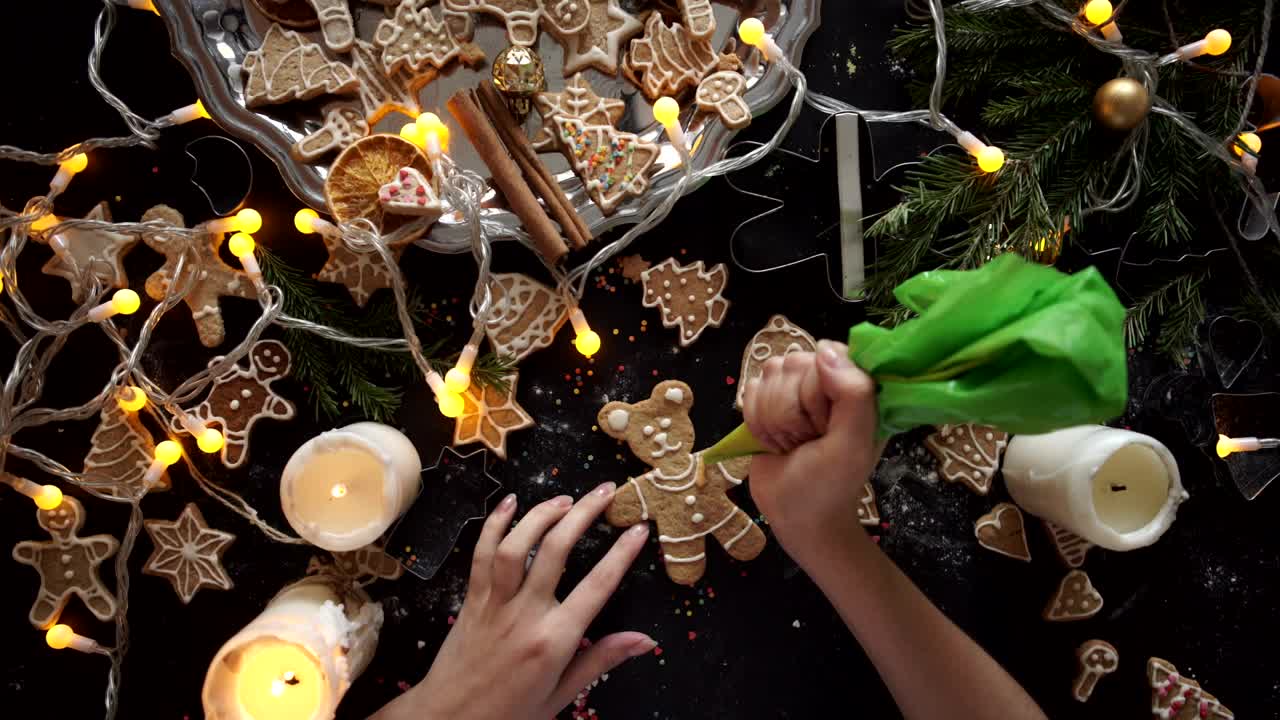 Free Video Stock top view of a persons hands preparing christmas cookies Live Wallpaper - Free Download