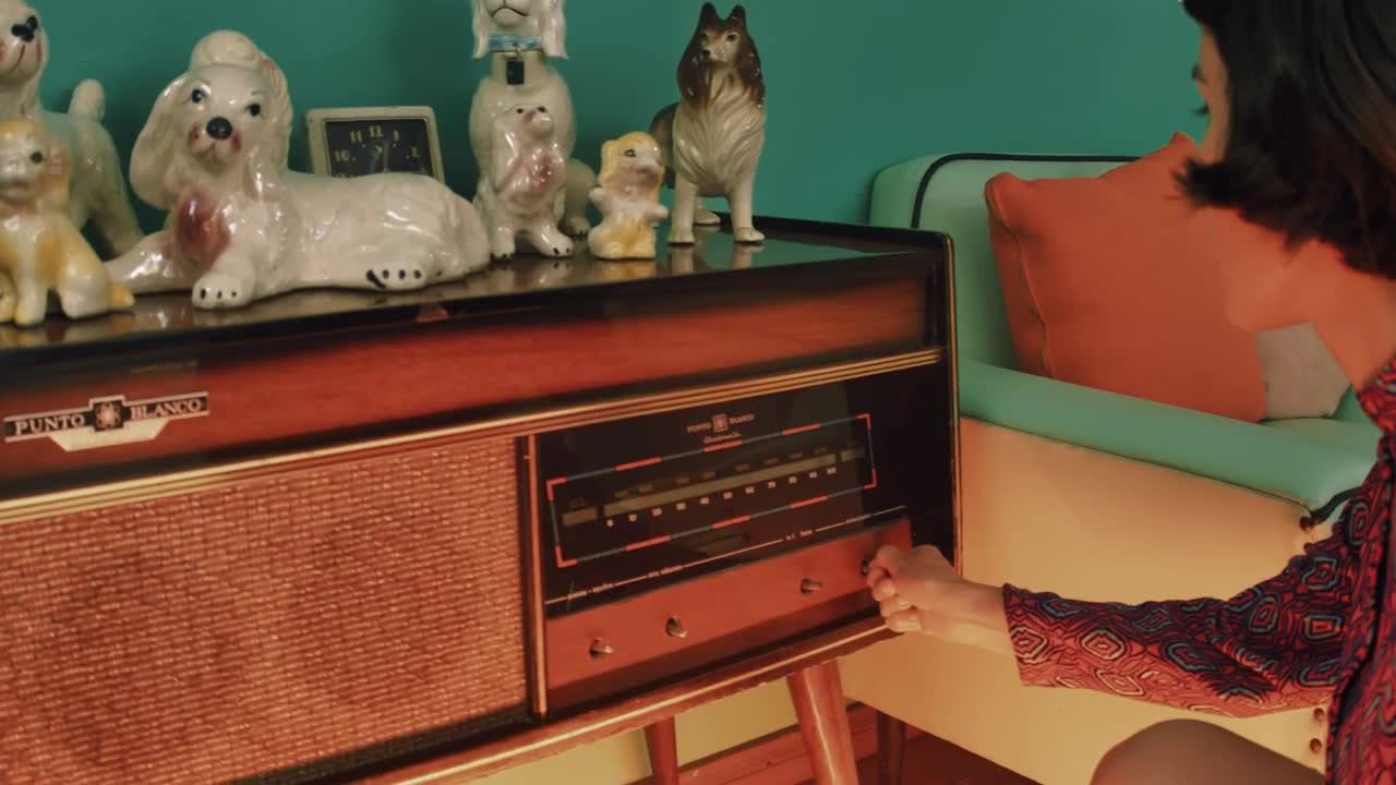 Free Stock Video Woman Turning On An Old Radio Live Wallpaper - Free Download