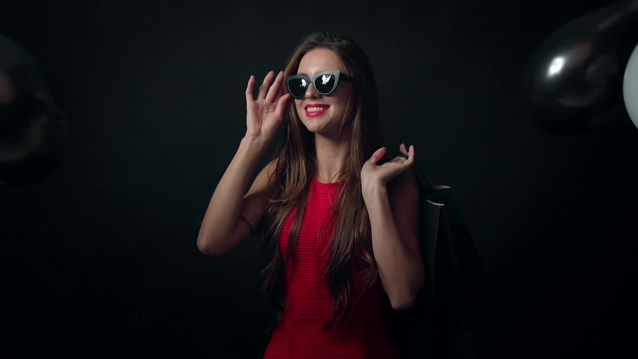 Free Video Stock Smiling Model With Falling Balloons On Black Background Live Wallpaper - Free Download