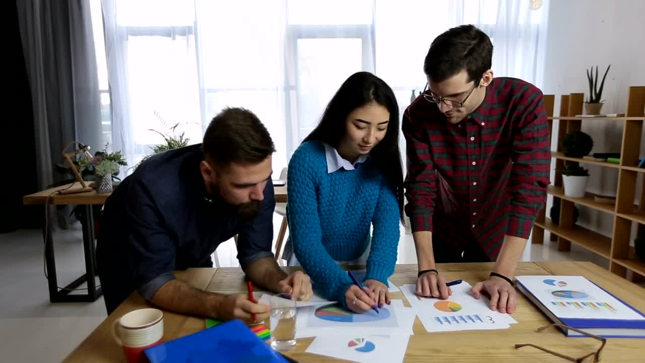 Free Video Stock team reviewing charts and reports Live Wallpaper - Free Download