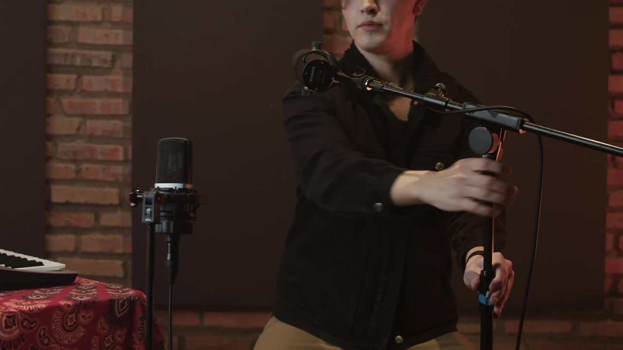 Free Stock Video Singer Arranging Her Microphones In A Recording Studio Live Wallpaper - Free Download