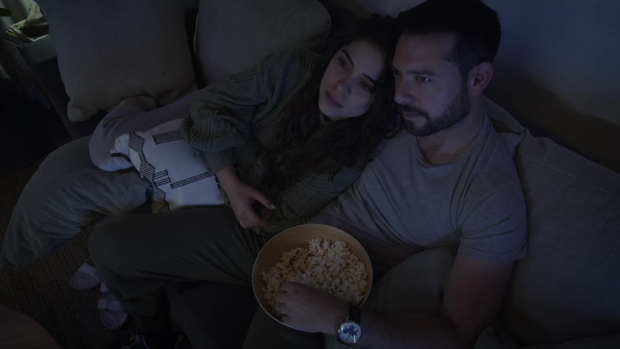 Stock Video Loving Couple Watching A Movie Together Animated Wallpaper - Free Download