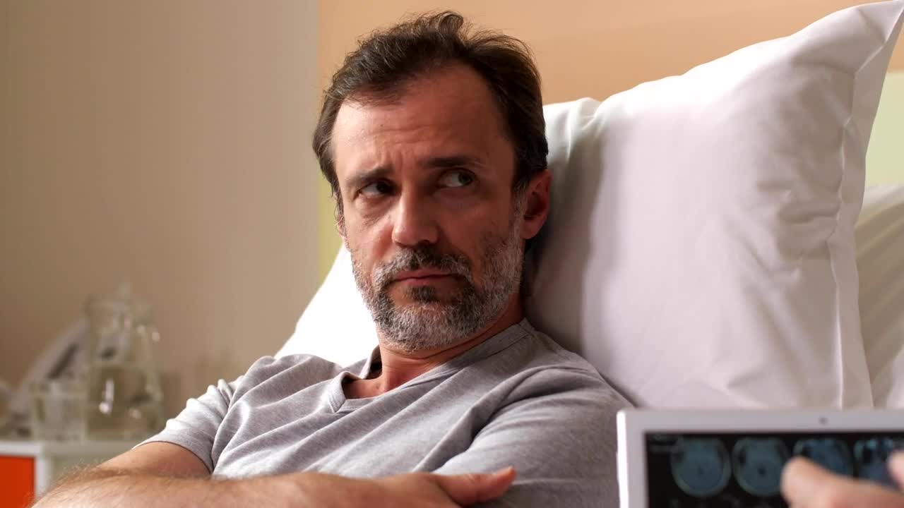 Stock Video Man Given Bad News By Their Doctor Animated Wallpaper - Free Download