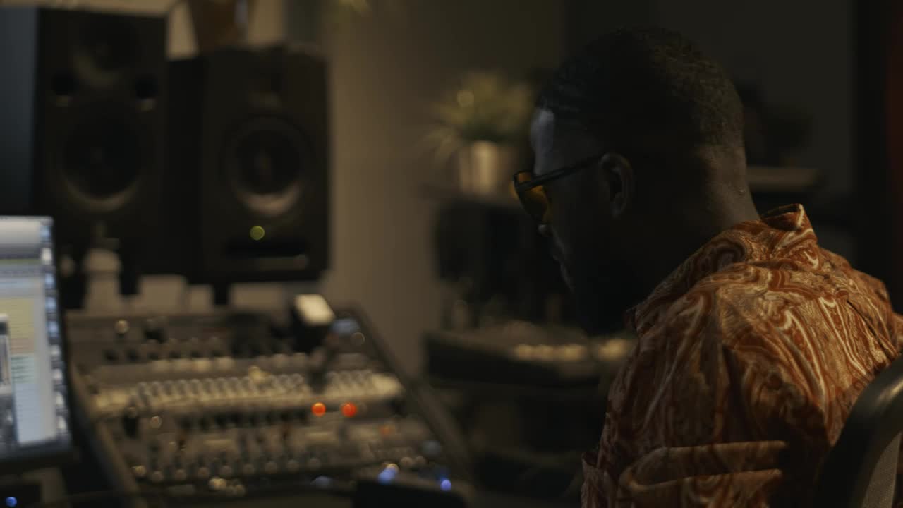 Stock Video Music Producer Working In A Studio Live Wallpaper - Free Download