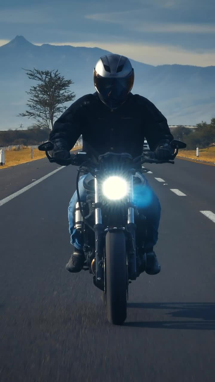 Stock Video Motorcyclist Going Down A Road Seen From The Front Live Wallpaper - Free Download