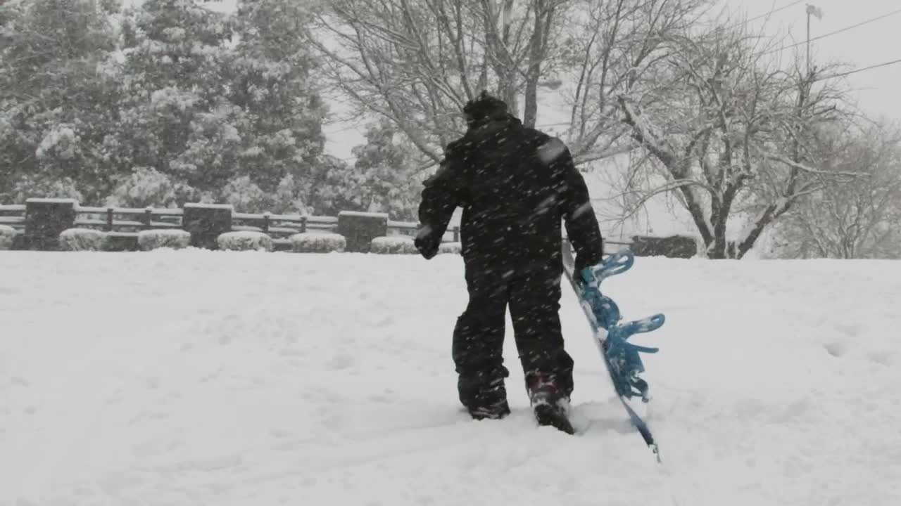 Stock Video Man Dragging His Snowboard Animated Wallpaper - Free Download