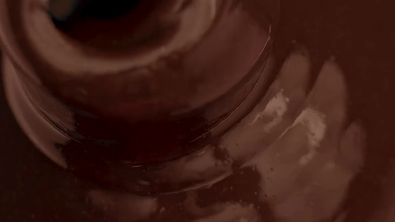 Stock Video Liquid Chocolate Flowing Into A Chocolate Fountain Animated Wallpaper - Free Download