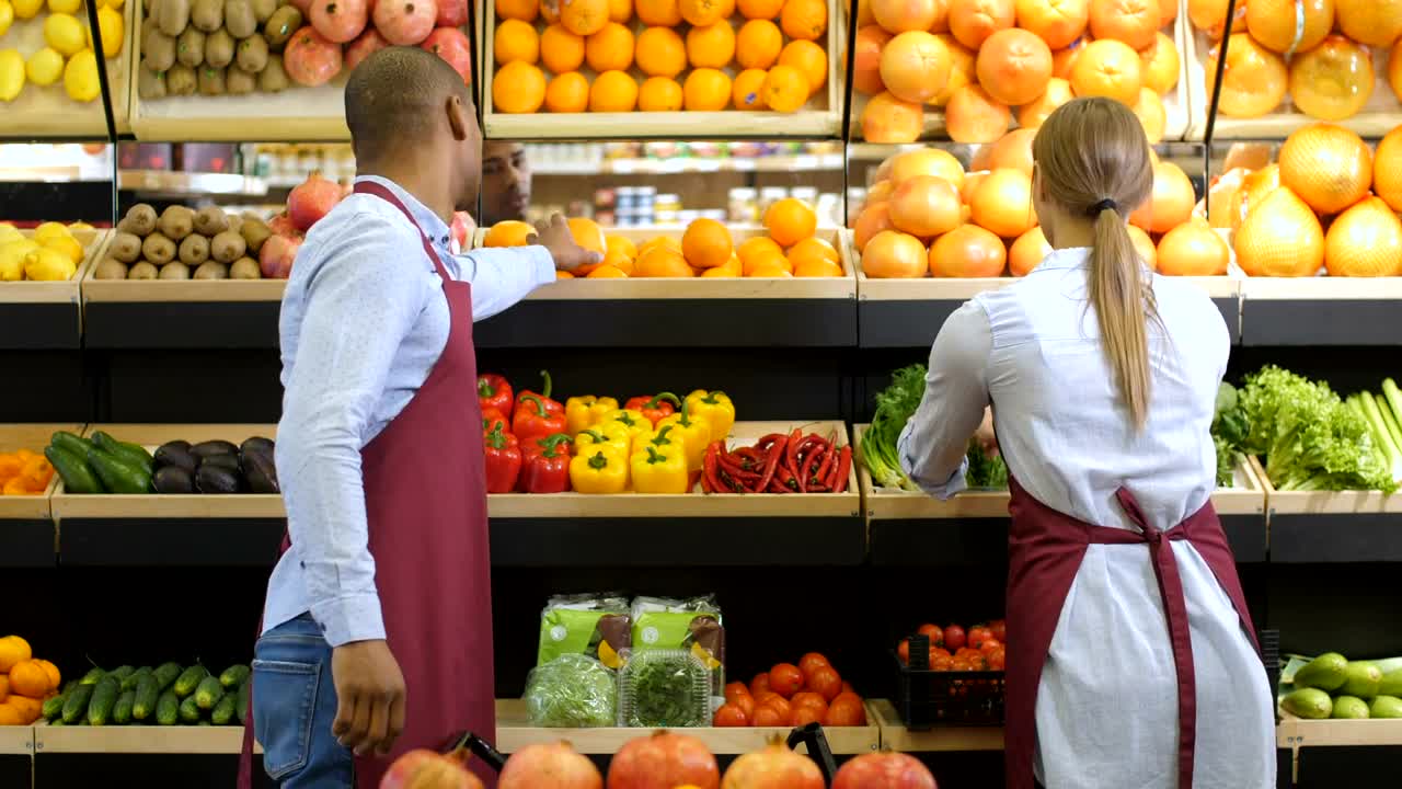 Stock Video Grocery Clerk Smelling Oranges Live Wallpaper For PC - Free Download