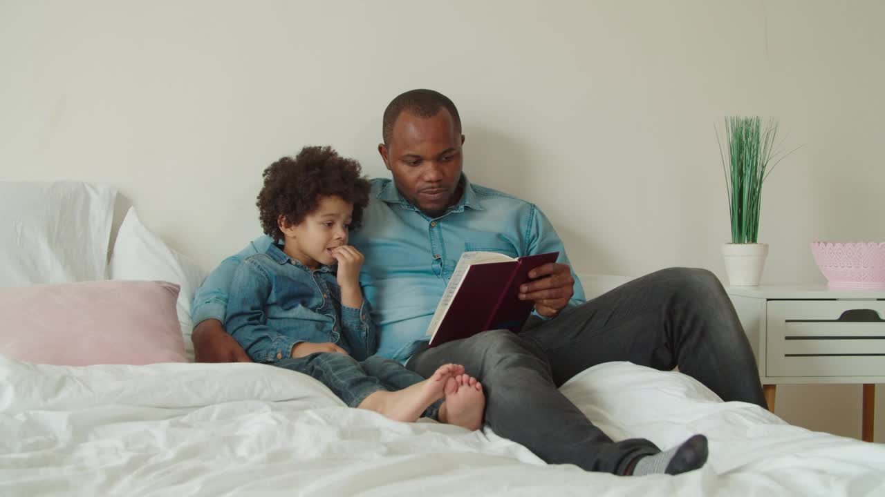 Stock Video Father And Son Reading A Book Together Live Wallpaper For PC - Free Download