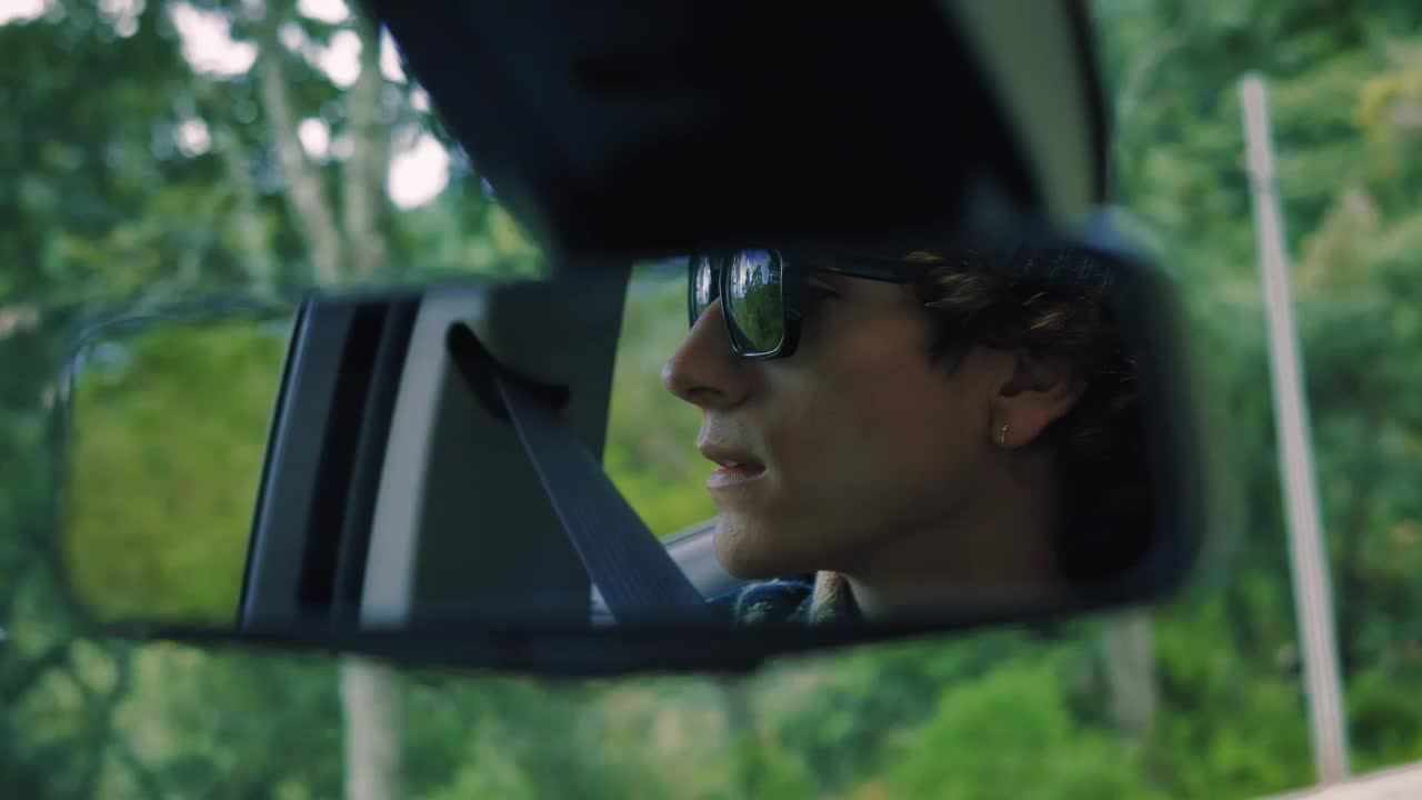 Stock Video Man In The Rear View Mirror Traveling Through A Fores Animated Wallpaper - Free Download