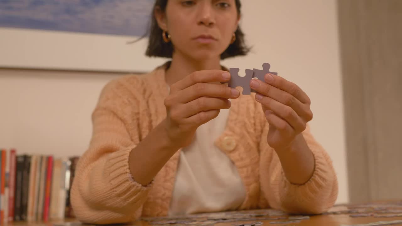 Free Stock Video Woman Putting Puzzle Pieces Together Live Wallpaper - Free Download
