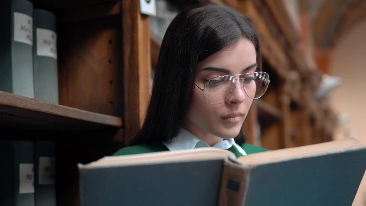 Free Video Stock Student Surprised By Something She Reads In Book Live Wallpaper - Free Download