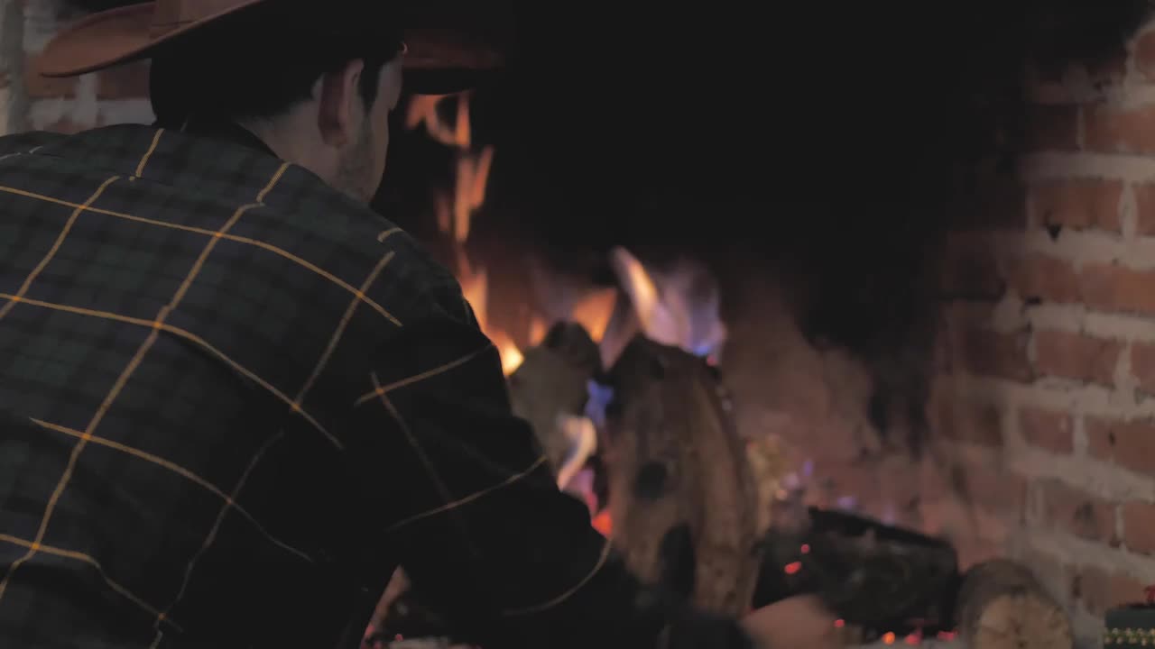 Stock Video Man Lighting Fireplace With Firewoo Animated Wallpaper - Free Download