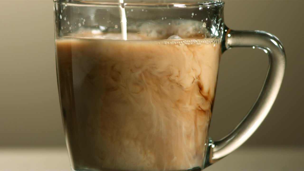 Stock Video Milk Poured Into Coffee In Slow Motio Animated Wallpaper - Free Download