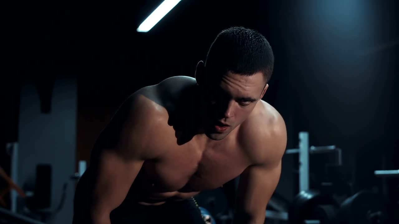 Free Video Stock tired athlete in a dark gym Live Wallpaper - Free Download