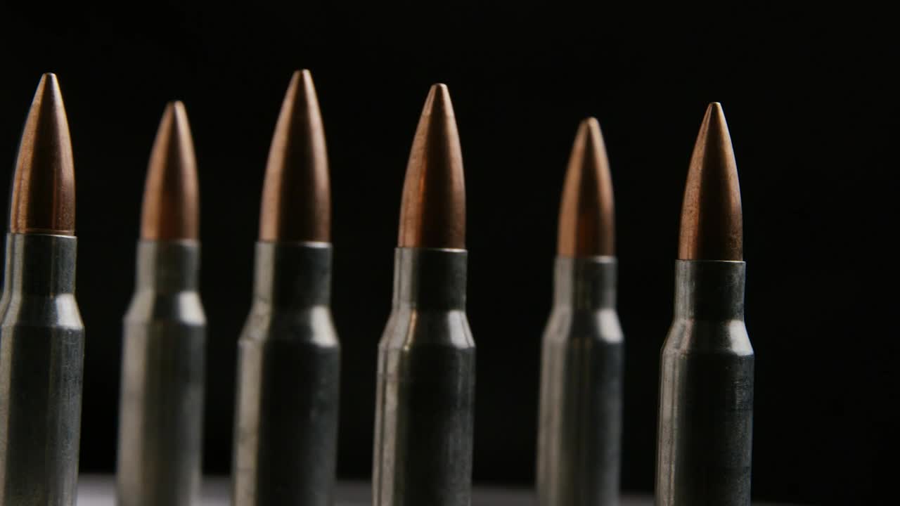 Stock Video Big Bullets Rotating On A Black Background Live Wallpaper For PC - Free Download