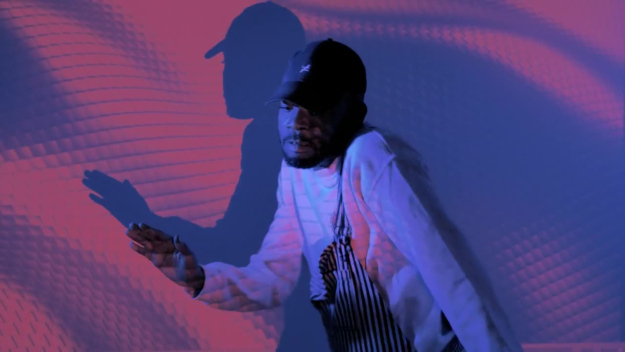 Stock Video Man Dancing With Shapes Projected On Him Animated Wallpaper - Free Download