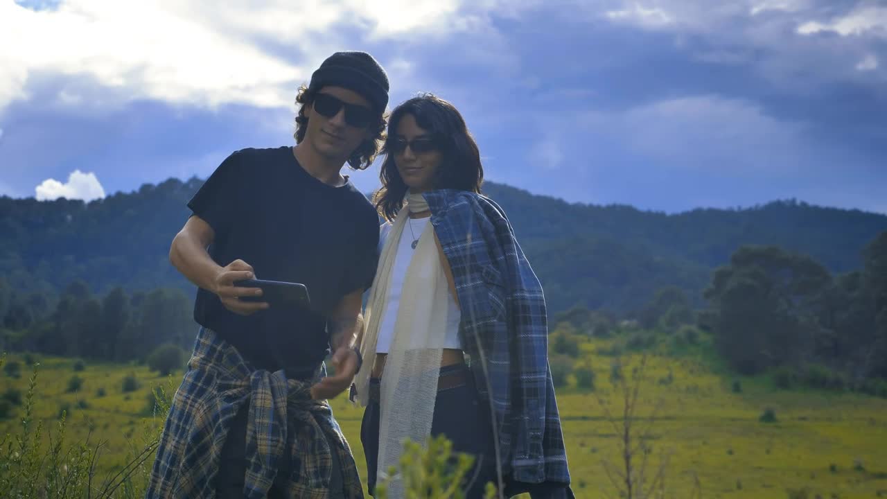 Stock Video Girl And Boy Taking A Selfie On A Natural Landscape Live Wallpaper For PC - Free Download