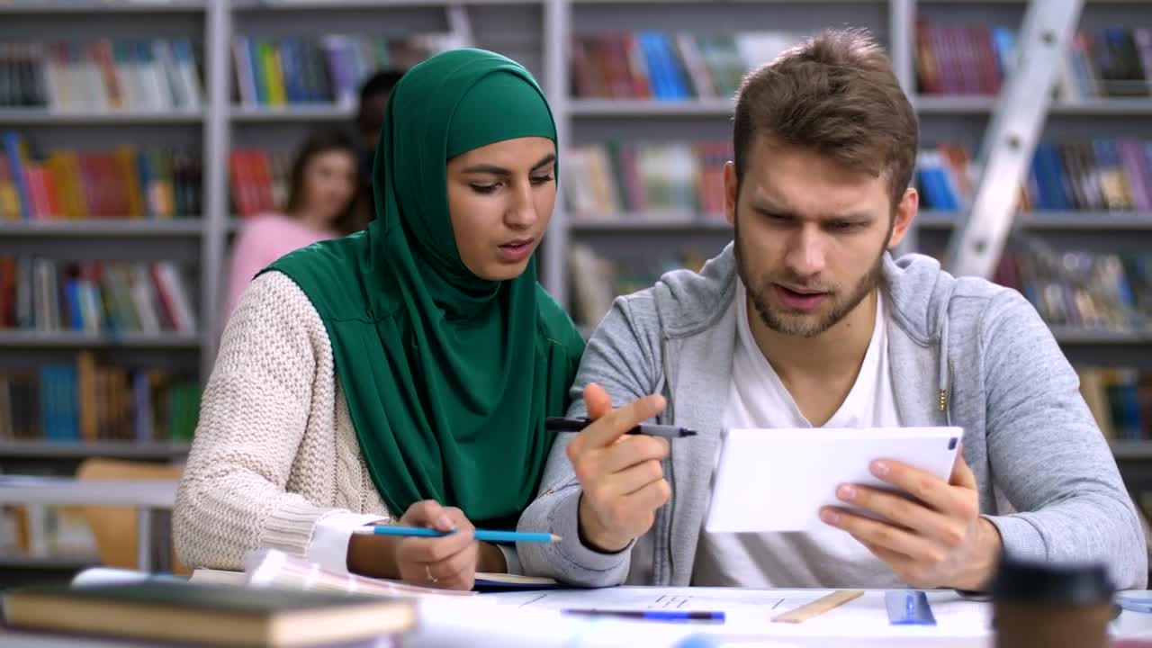 Free Video Stock Students Researching Using A Tablet At Library Live Wallpaper - Free Download