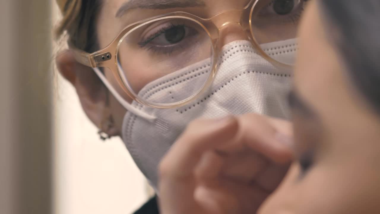 Stock Video Face Of A Makeup Artist With A Mask Working Live Wallpaper For PC - Free Download