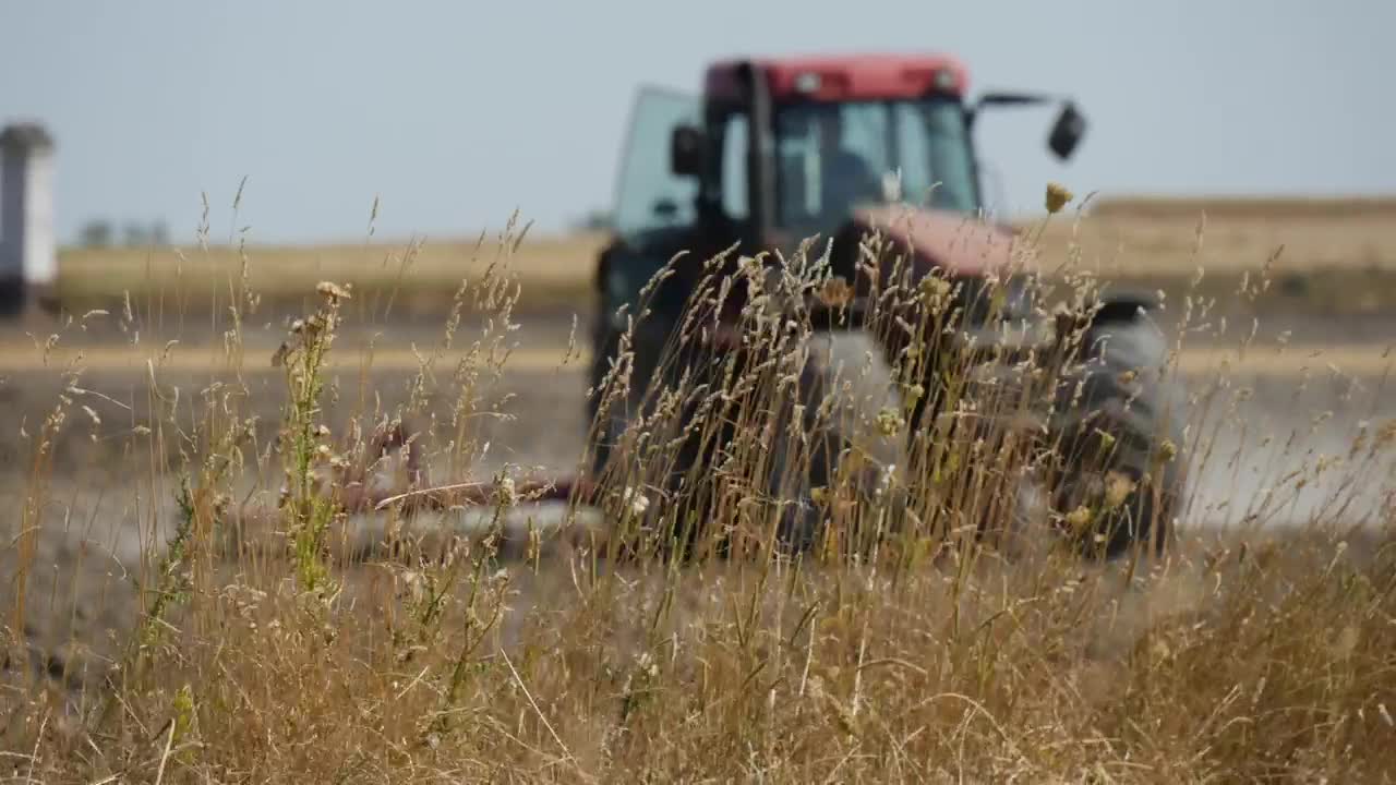 Free Video Stock tractor working on the agricultural field Live Wallpaper - Free Download
