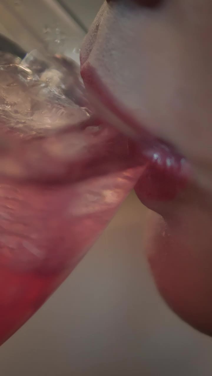 Free Video Stock the mouth of a woman taking a cocktail Live Wallpaper - Free Download