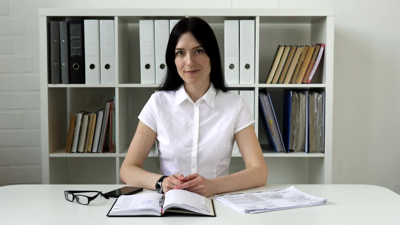 Video Stock Businesswoman Smiling At Her Desk Live Wallpaper For PC - Free Download