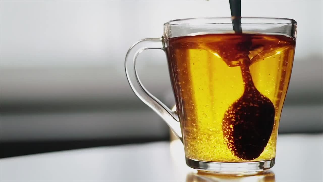 Free Video Stock Spoon Stirring Sugar In Clear Glass Tea Cup Live Wallpaper - Free Download