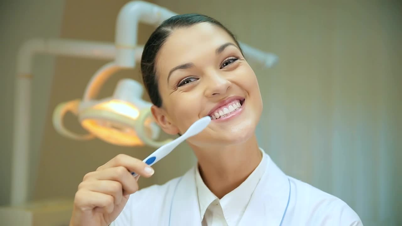 Stock Video Female Dentist Teaching How To Brush Teeth Live Wallpaper For PC - Free Download