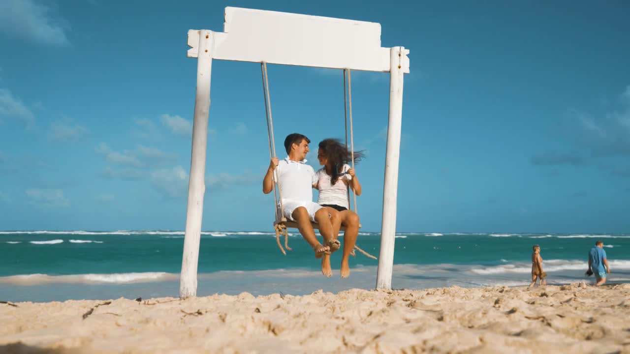 Stock Video Couple On A Swing On A Beach Live Wallpaper For PC - Free Download
