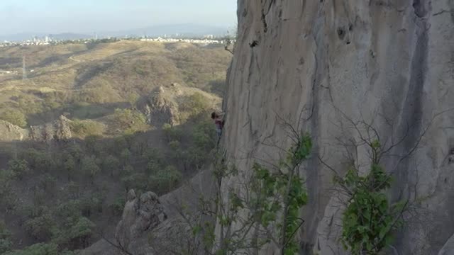 Free Stock Video Woman Climbing A Vertical Rocky Of A Large Mountain Smalllive Wallpaper - Free Download