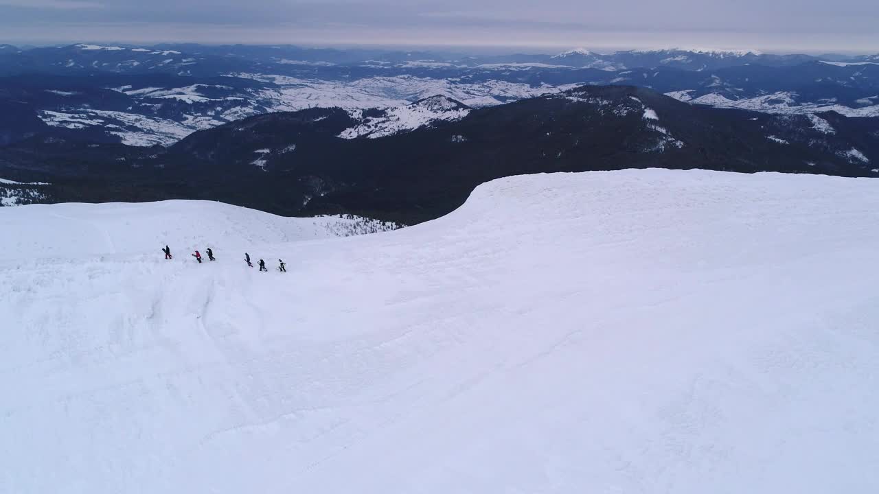 Free Video Stock Snowboarders Walking In The Snow Drone Shot Live Wallpaper - Free Download