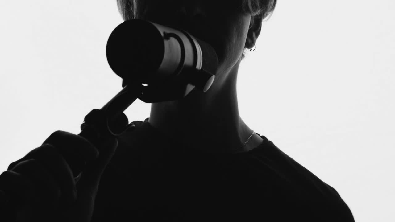 Free Stock Video Silhouette Of A Man Singing On A White Background Live Wallpaper - Free Download