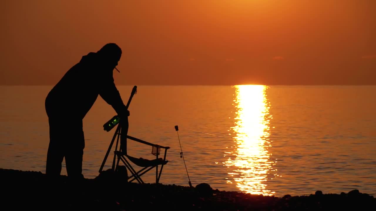 Free Stock Video Silhouette Of A Man Preparing Chair To Fish Live Wallpaper - Free Download