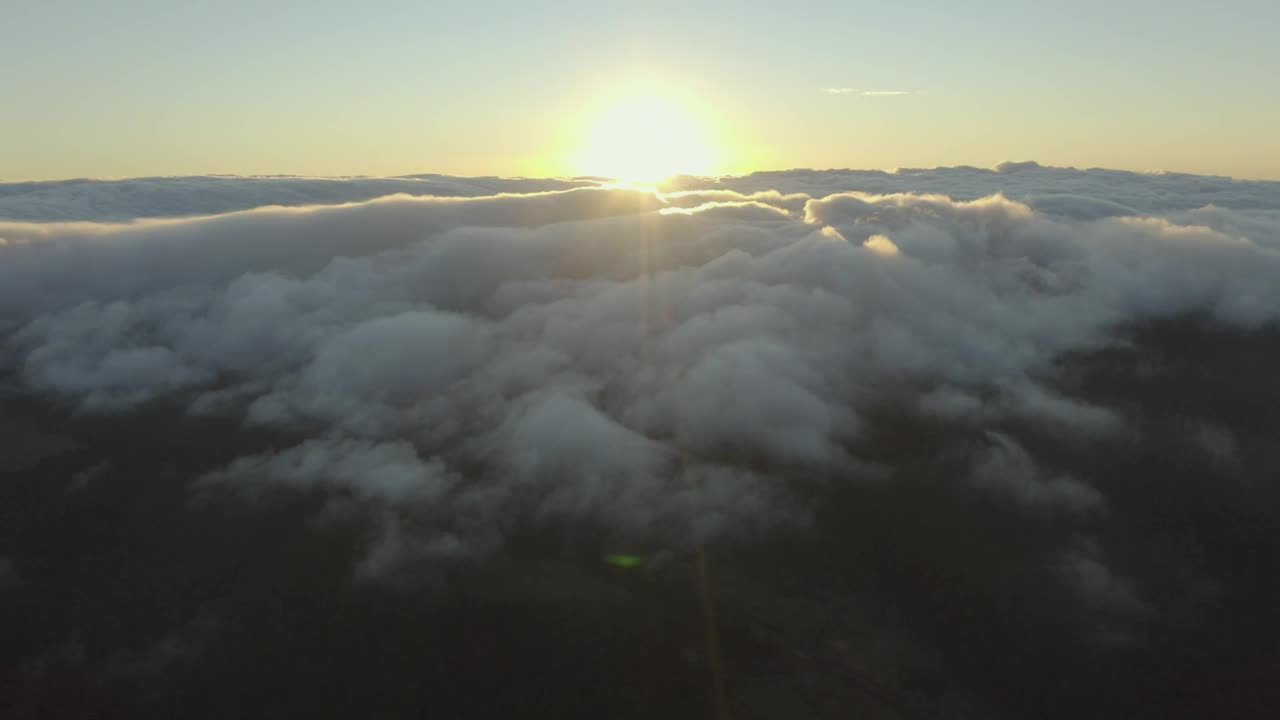 Free Video Stock the sun setting on the horizon of a cloudy mountain Live Wallpaper - Free Download