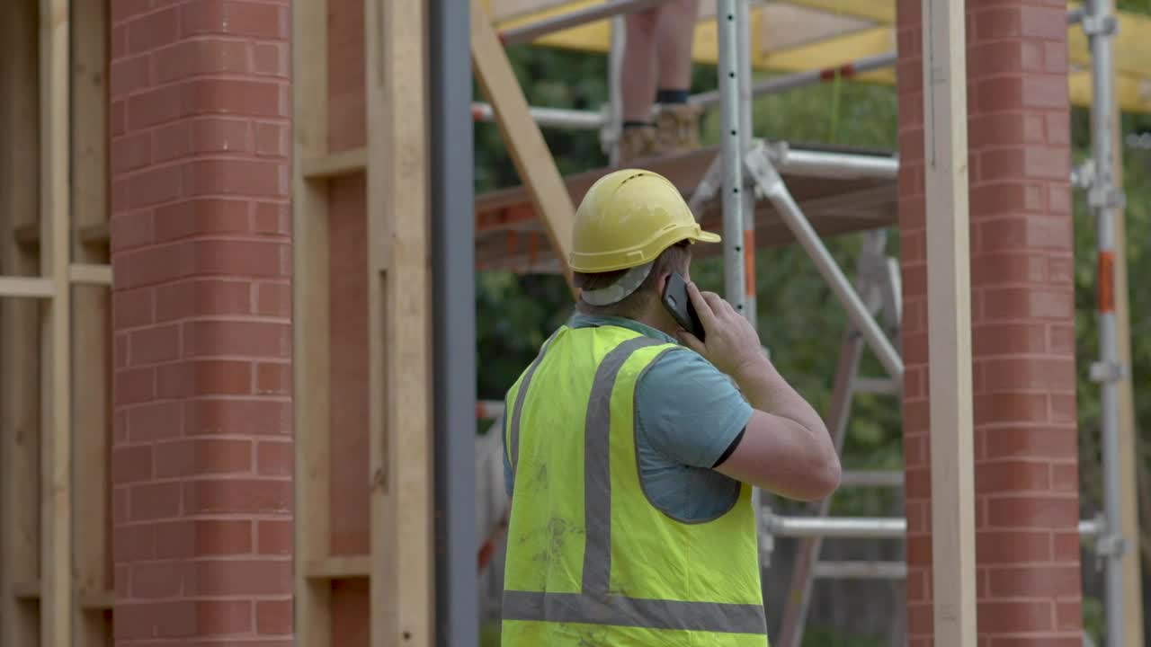 Stock Video Man On The Phone Near A Construction Sit Animated Wallpaper - Free Download