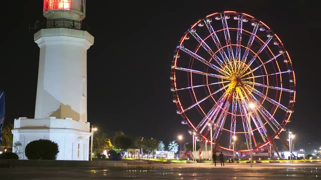 Stock Video Ferris Wheel Near The Lighthouse At Night Live Wallpaper For PC - Free Download