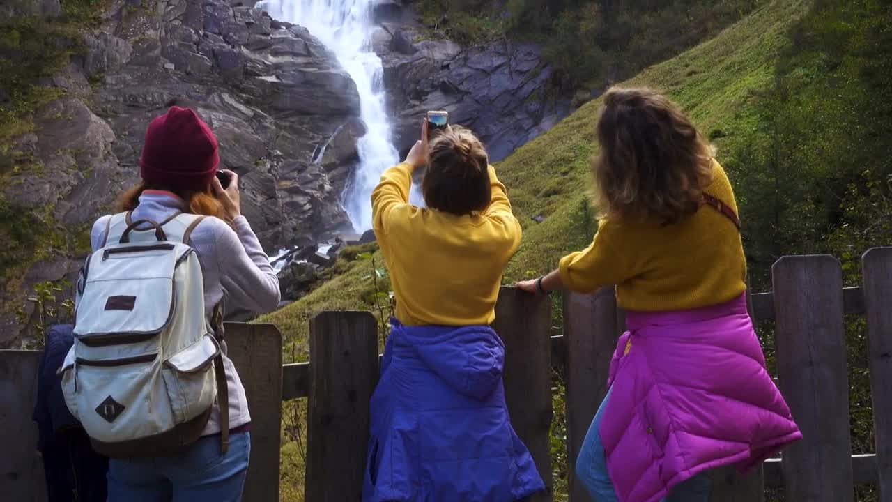 Free Video Stock tourists taking photos to a waterfall Live Wallpaper - Free Download