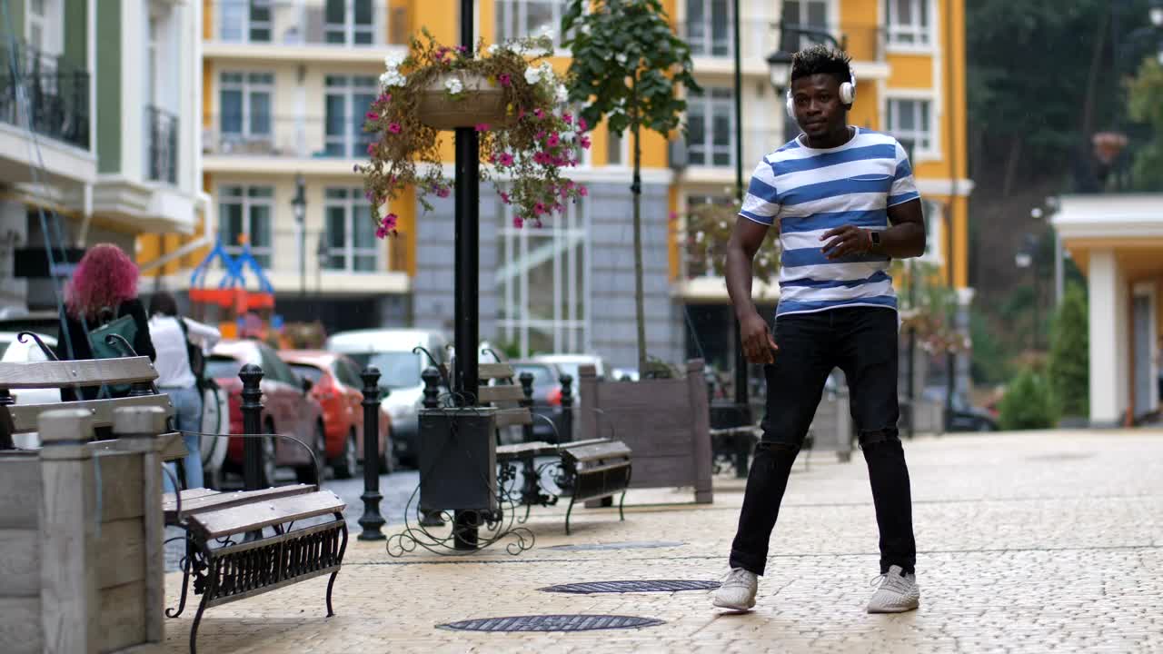 Stock Video Man Dancing In The Street With Headphones Animated Wallpaper - Free Download