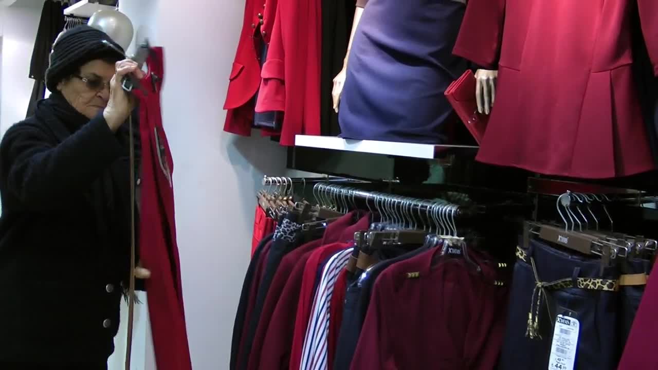 Stock Video Grandmother Shopping In A Clothing Store Live Wallpaper For PC - Free Download