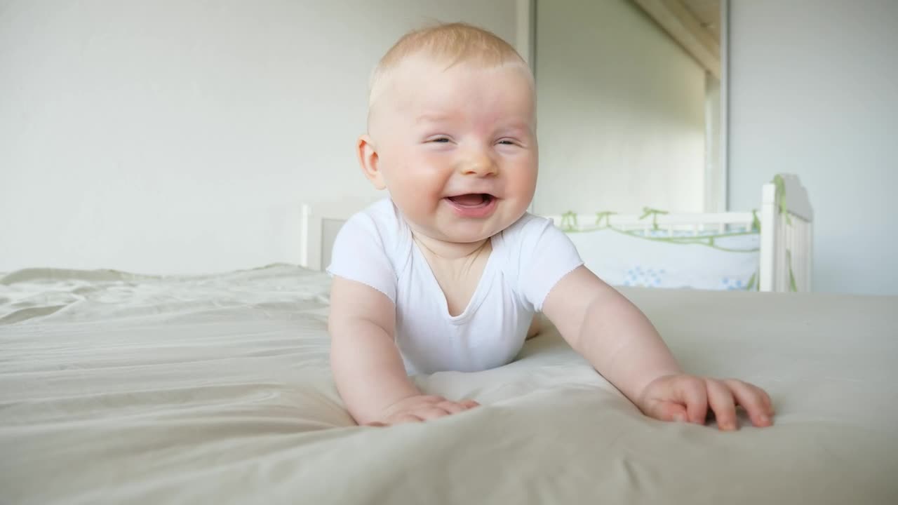 Stock Video Cute Laughing Baby Rolls Over On Bed Live Wallpaper For PC - Free Download