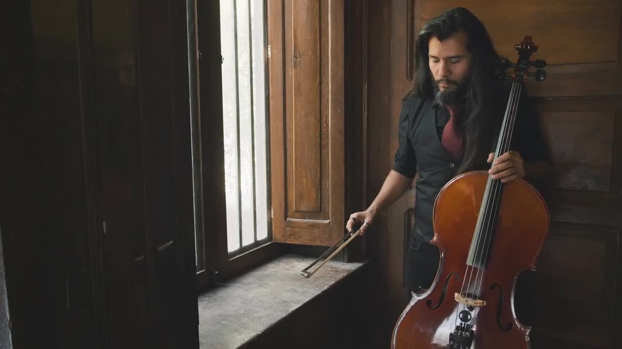 Stock Video Man Holding A Cello Animated Wallpaper - Free Download